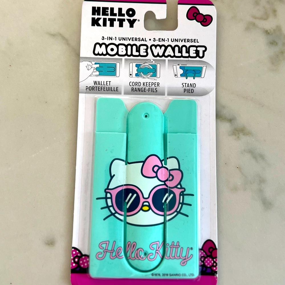 Hello Kitty wallet/phone  NWT attach to phone use also as stand.